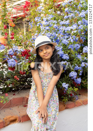 Little latin girl with straw hat and dress 133224717