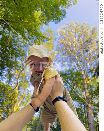Joyful Baby Lifted in Forest Joyful Baby Lifted in Forest 133224790