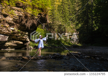Woman Dancing in a Forest Stream 133224795