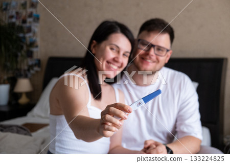 Happy Couple Celebrating Positive Pregnancy Test Happy Couple Celebrating Positive Pregnancy Test 133224825