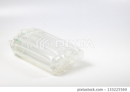 Close up plastic translucent air packaging, Plastic translucent packaging with air cushion. Inflatable air bag isolated on white background. Close up plastic translucent air packaging, Plastic translucent packaging with air cushion. Inflatable air bag isolated on white background. 133225569
