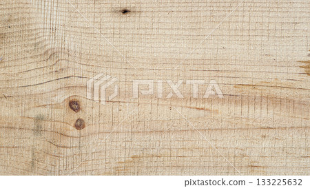 Raw wood surface with visible knots and curved natural grain. Natural background for carpentry, rustic and textured wooden backdrop design 133225632