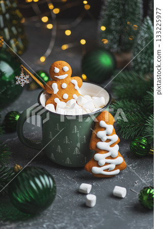 Gingerbread Cookie Man into Christmas Mug with Marshmallows and Festive Decor Gingerbread Cookie Man into Christmas Mug with Marshmallows and Festive Decor 133225977