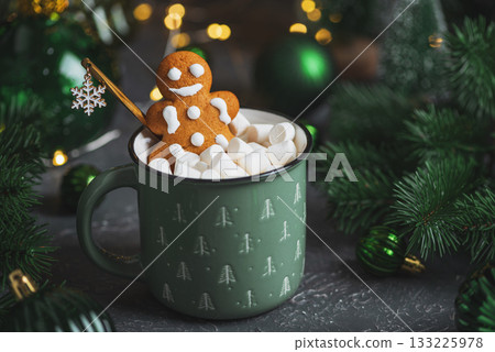 Gingerbread Cookie Man into Christmas Mug with Marshmallows and Festive Decor Gingerbread Cookie Man into Christmas Mug with Marshmallows and Festive Decor 133225978