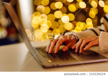 Close-up of hands working on a laptop keyboard. Freelance, online course. Shopping online. Close-up of hands working on a laptop keyboard. Freelance, online course. Shopping online. 133226224