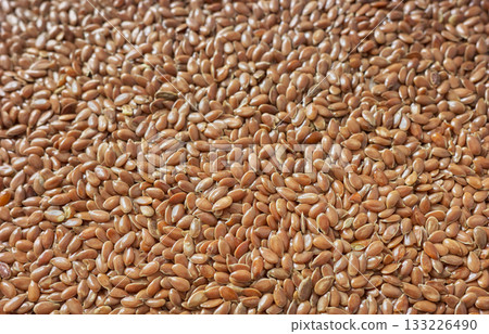 Close up photo of organic flax seeds, selective focus. 133226490
