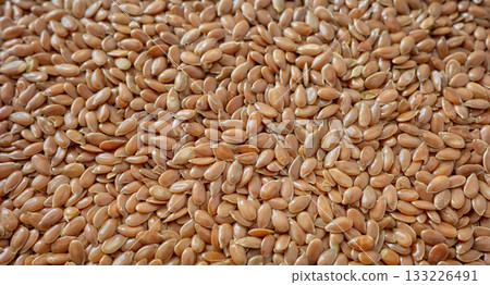 Close up photo of organic flax seeds, selective focus. 133226491