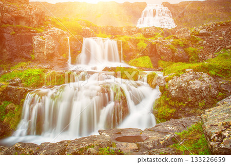 Dynjandi is one the most famous waterfall of the West Fjords of Iceland at summer 133226659