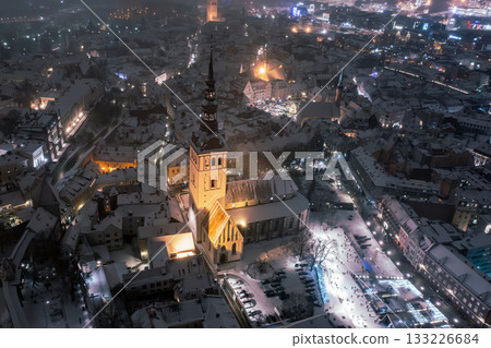 Aerial night View of Tallinn in winter, roofs are covered with snow, Christmas mood 133226684