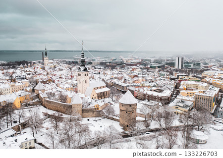 Aerial View of Tallinn in winter, roofs are covered with snow, Christmas mood 133226703