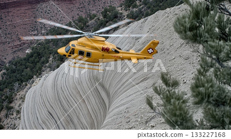Rescue Helicopter Hovers Above the Stunning Landscape of the Grand Canyon With Vivid Colors 133227168
