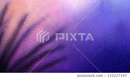 Close up of Frosted Windowpane With Soft Light Creating a Dreamy Atmosphere and Colorful Patterns 133227347