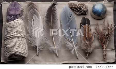 A Diverse Assortment of Mystical Creature Artifacts is Arranged on a Soft, Neutral Cloth 133227367