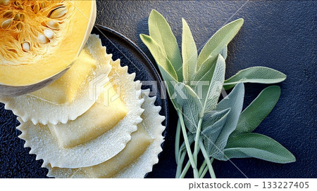 Handcrafted Pumpkin Ravioli and Fresh Sage on Dark Kitchen Countertop in Cozy Kitchen Setting 133227405