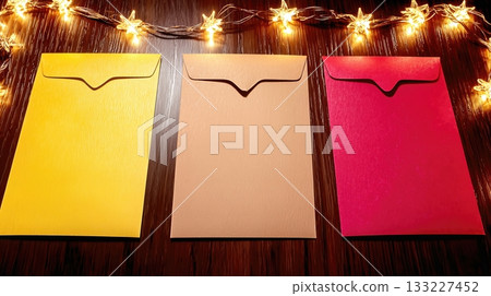 Lunar New Year Envelopes on a Wooden Surface With Decorative Lights for Celebration 133227452