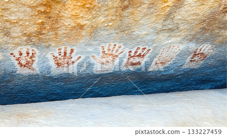 Ancient Cave Wall Displaying Primitive Handprints From Prehistoric Humans 133227459
