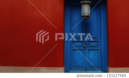 Bright Blue Door Contrasts With Red Wall in a Traditional Chinese Architectural Setting Bright Blue Door Contrasts With Red Wall in a Traditional Chinese Architectural Setting 133227484