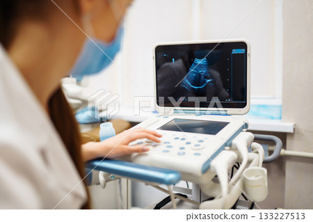 Ultrasound machine in the doctor's office in the clinic Diagnostics. Sonography. Pregnancy. 133227513