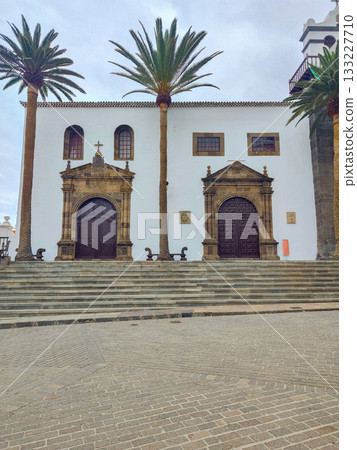 Experience the beauty of Historic Architecture alongside Palm Trees in a Scenic Plaza area Experience the beauty of Historic Architecture alongside Palm Trees in a Scenic Plaza area 133227710