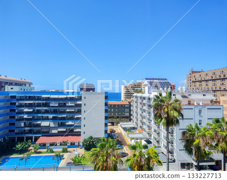 Experience a Stunning Coastal Resort View Featuring a Clear Blue Sky and Inviting Pool 133227713