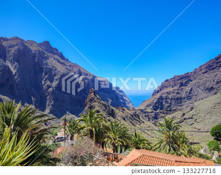 Enjoy the breathtaking mountain view that beautifully overlooks the vast ocean horizon 133227718