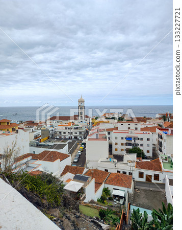 Coastal Village Overlook Featuring a Breathtaking Scenic View of the Beautiful Sea 133227721
