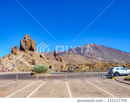 A breathtakingly stunning Rocky landscape unfolds beneath an expansive and clear blue sky A breathtakingly stunning Rocky landscape unfolds beneath an expansive and clear blue sky 133227748