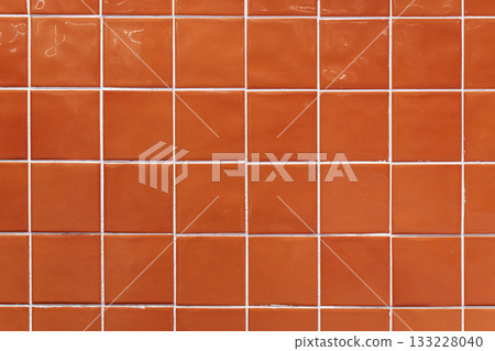 Orange ceramic tile background. Old vintage ceramic tiles in green to decorate the kitchen or bathroom  133228040