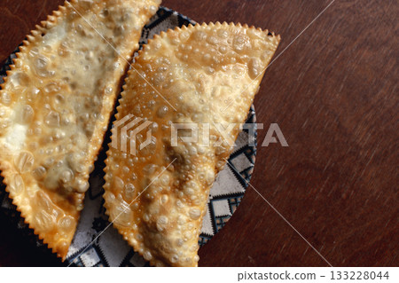 Crispy Chebureki. Traditional Fried Pastry on Plate 133228044