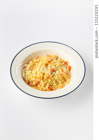 Couscous with vegetables in a white bowl, studio shot on white background Couscous with vegetables in a white bowl, studio shot on white background 133228191