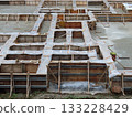 Construction work: pouring ready-mixed concrete 133228429