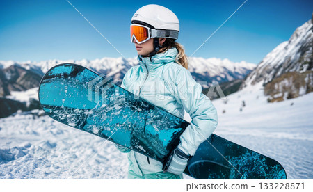 Female Snowboarder Enjoying Winter Sports in Scenic Mountain Landscape 133228871
