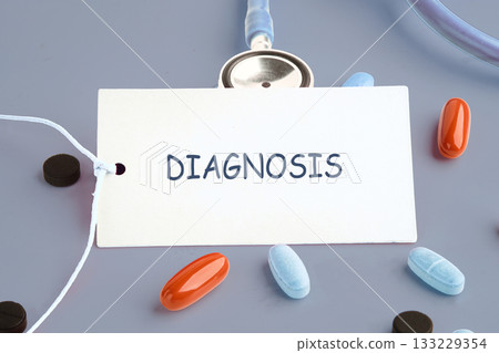 A stethoscope rests beside an identification card labeled diagnosis, as various colored pills surround it, highlighting the importance of medical evaluations and treatment options A stethoscope rests beside an identification card labeled diagnosis, as various colored pills surround it, highlighting the importance of medical evaluations and treatment options 133229354