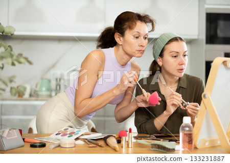 Woman doing eyebrow makeup with brush Woman doing eyebrow makeup with brush 133231887