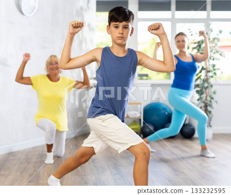 Group of people in gym incendiary dance doing fitness Group of people in gym incendiary dance doing fitness 133232595