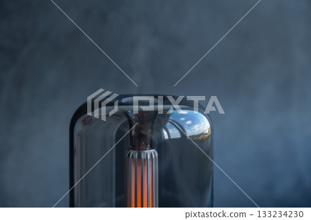 Indoors Decoration with modern lighted Air Humidification Aroma essential oil perfume fragrance. Scented home wellness wellbeing habit. Concept of feeling good spiritual health 133234230