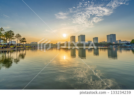 Sunset scenery by the city lake 133234239