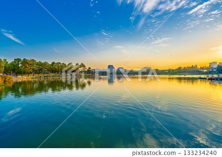 Sunset scenery by the city lake 133234240