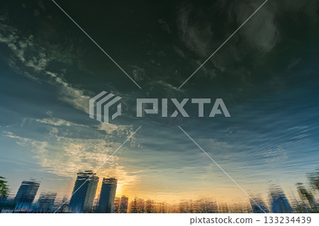The city skyline reflected on the water at dusk 133234439