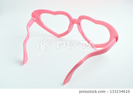 pink heart shape of glasses on white background 133234610