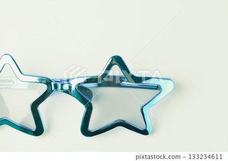 blue star shape of glasses on old sepia background 133234611