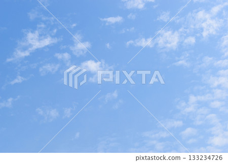 beautiful blue sky and white fluffy group of clouds with sunrise in the morning, natural background beautiful blue sky and white fluffy group of clouds with sunrise in the morning, natural background 133234726