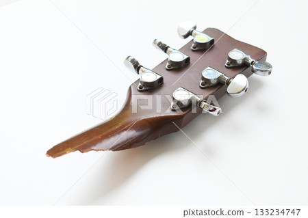 part of broken wood acoustic guitar isolated on white background 133234747