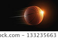 Speedy basketball and light trails on a black background 133235663