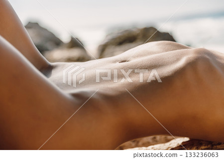 Close up view of sexy female body, tanned skin 133236063