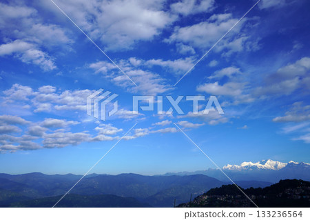 Kangchenjunga Range Under a Dramatic Blue Sky with Altocumulus Clouds 133236564