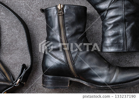 Side-zip boots and accessories on concrete Side-zip boots and accessories on concrete 133237190