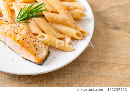 salmon with penne pasta cream sauce 133237522