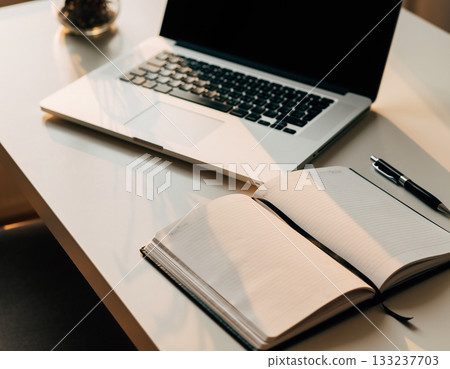 A laptop computer placed on the desk 133237703