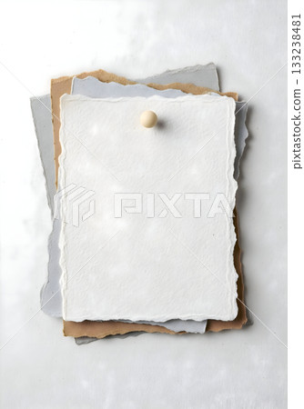 Stack of Deckle-Edge Handmade Papers with Pin 133238481